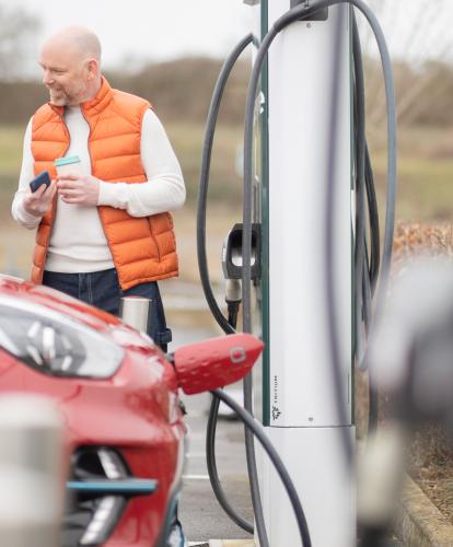 Stock photo-  Evyve charge point - couple charging