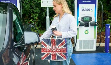 bp pulse charger at M&S store - lady holding M&S bag while charging car